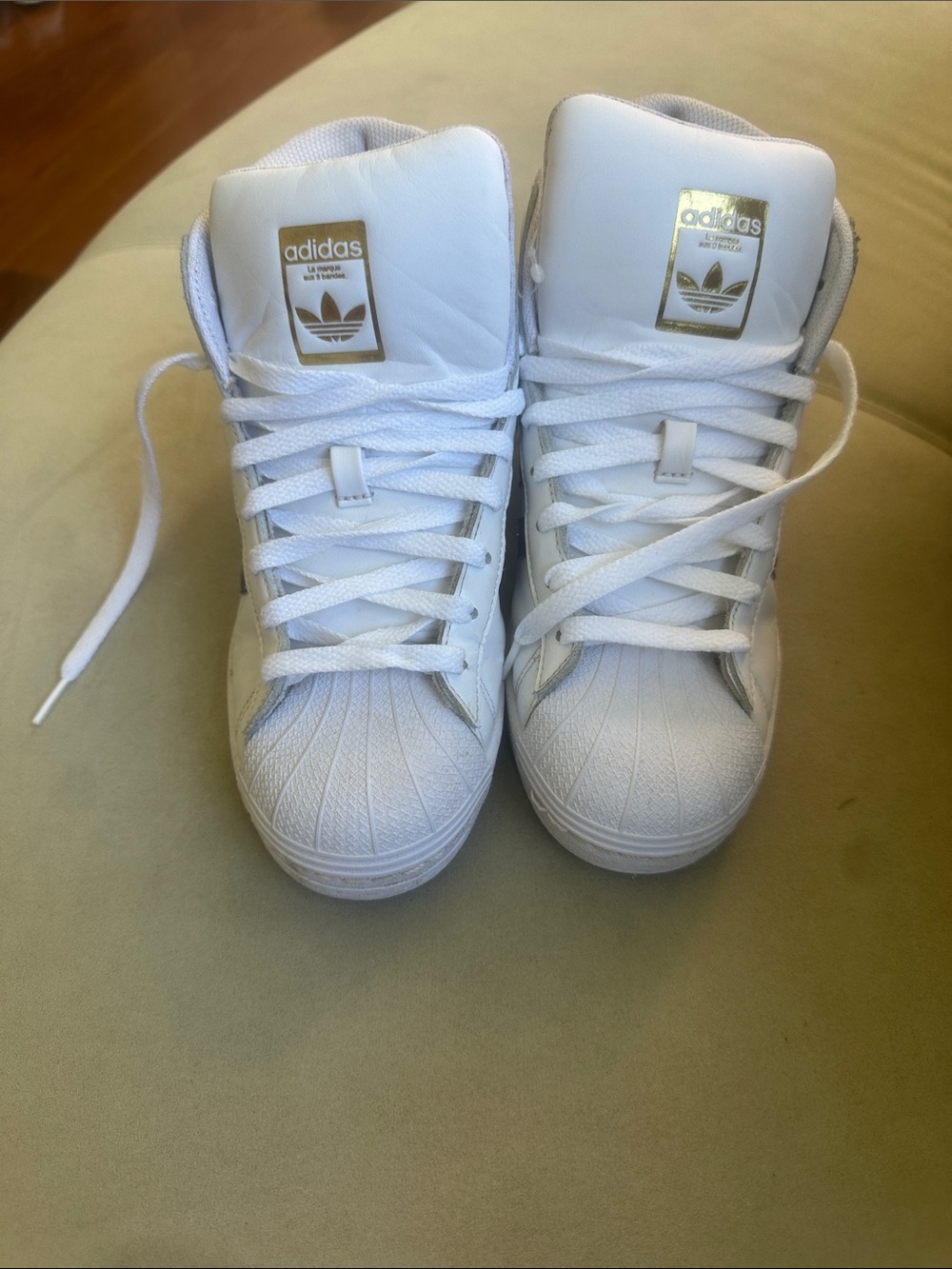 adidas Men’s White High-Top Sneakers with Gold Logo Accents